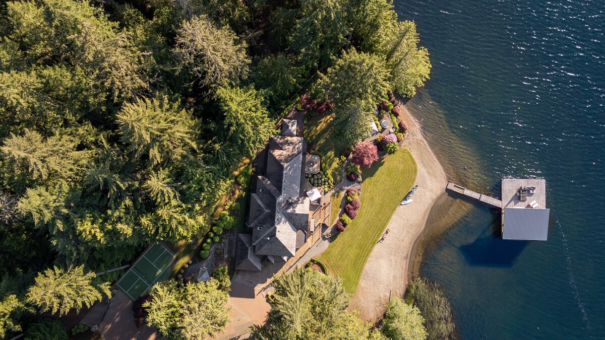 Aerial view of Shawnigan Retreats — both houses, dock, and lake.