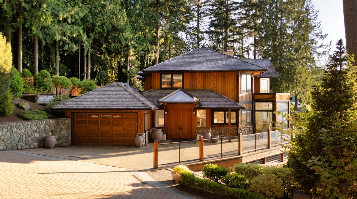 Main house exterior with cedar and stone detailing