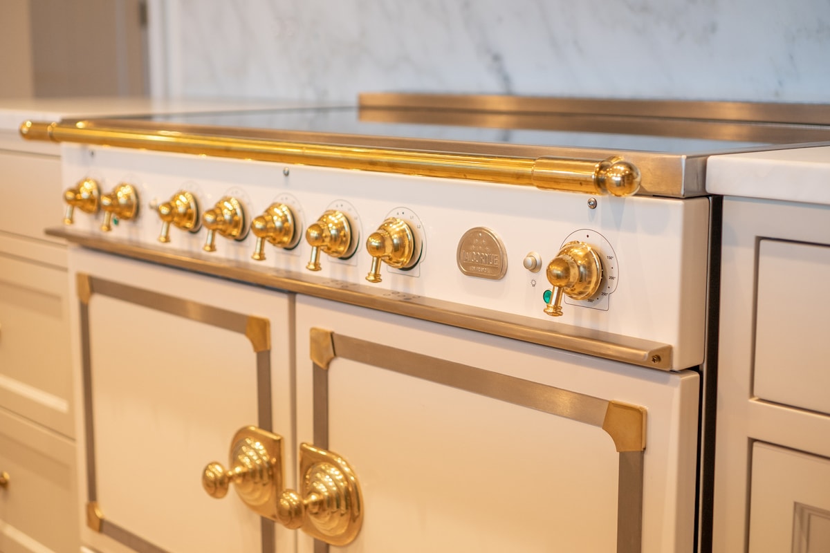 Lacanche range with brass fittings in the chef's kitchen