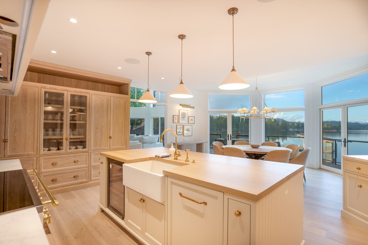 Kitchen island with farmhouse sink and lake views