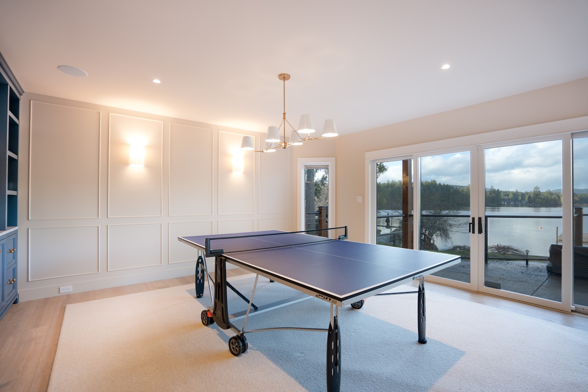 Games room with ping pong table and lake views