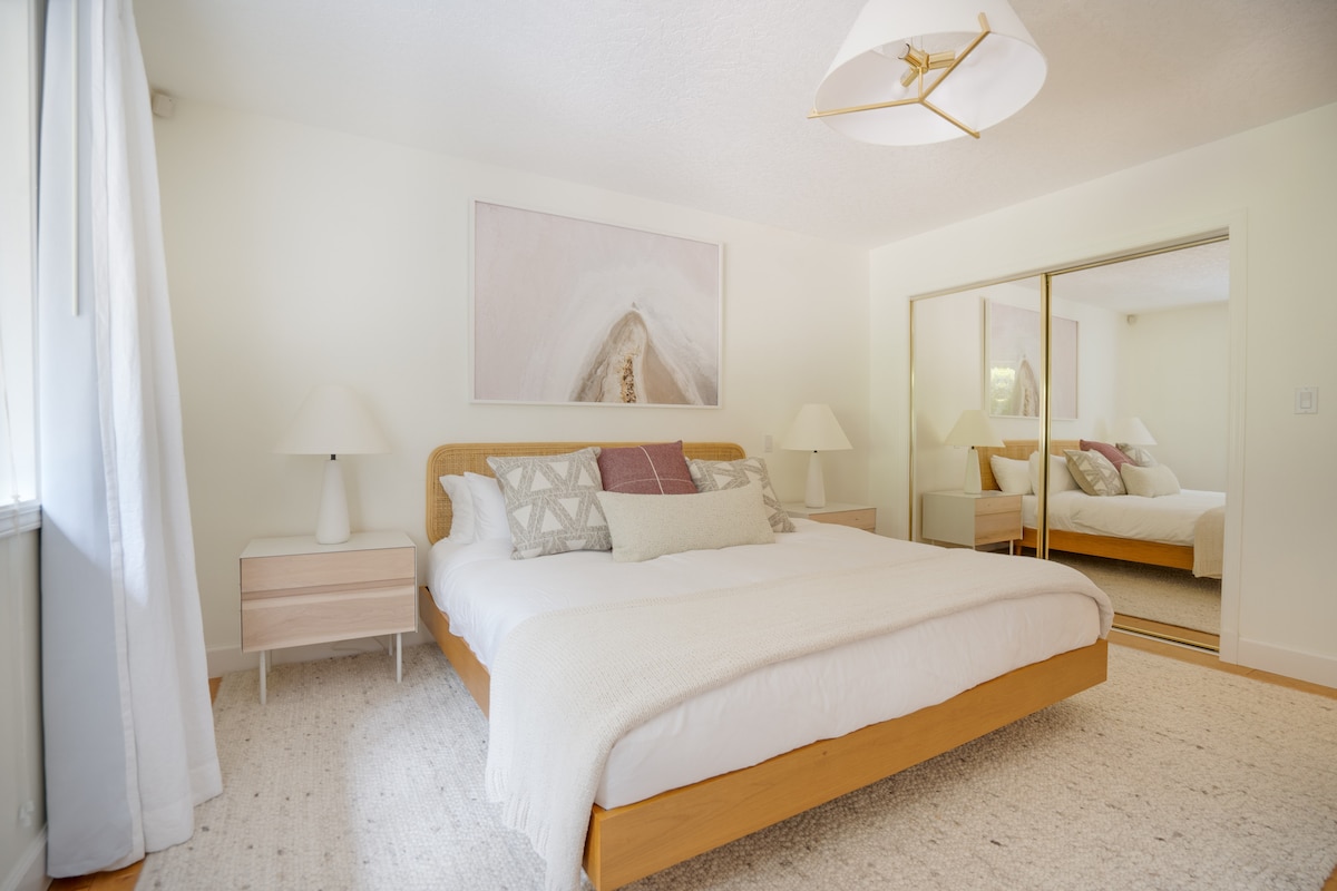 Cottage primary bedroom with king bed