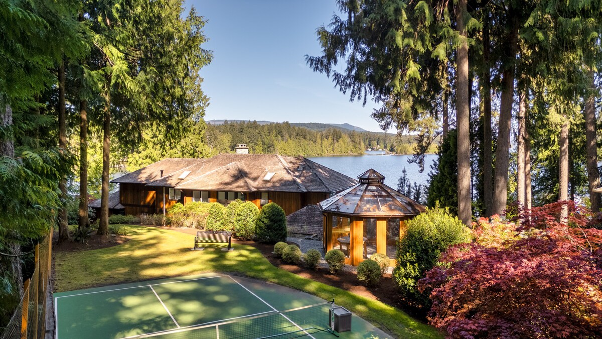 Aerial of property showing court, gazebo and lake