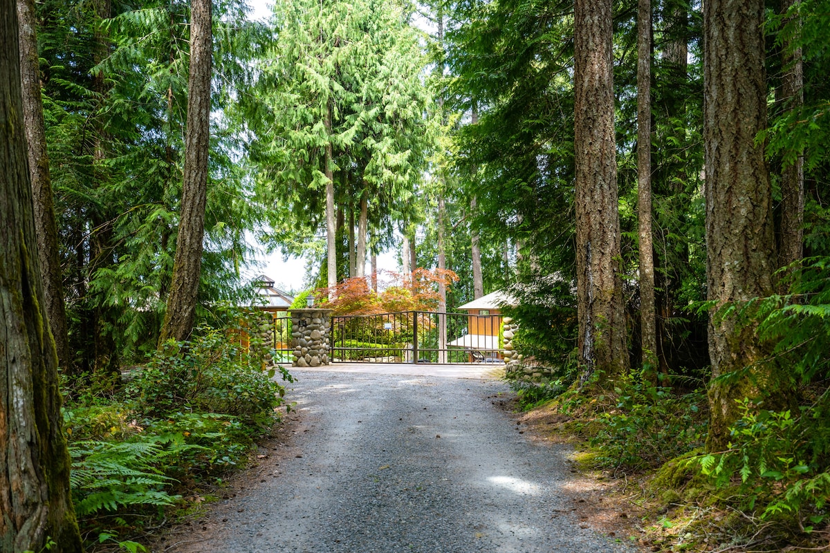 Private gated entry through old-growth forest