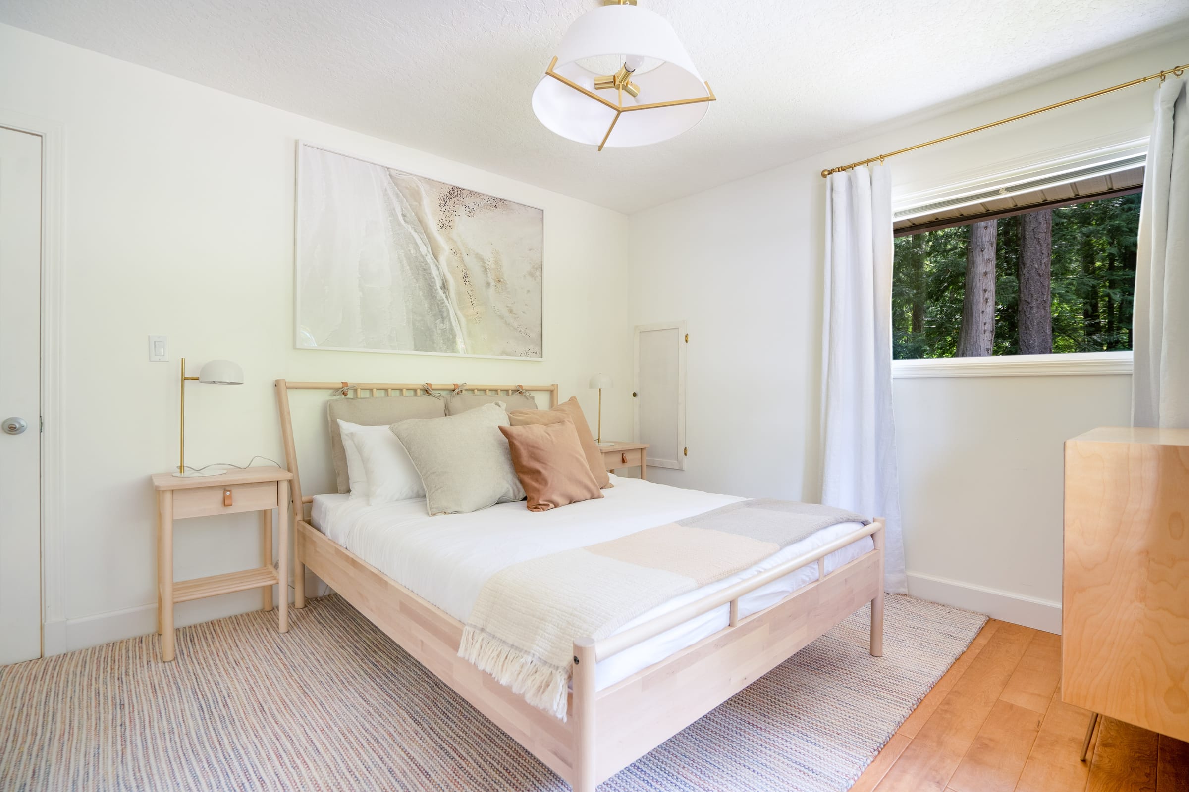 Cottage bedroom with linen sheets and west-facing window