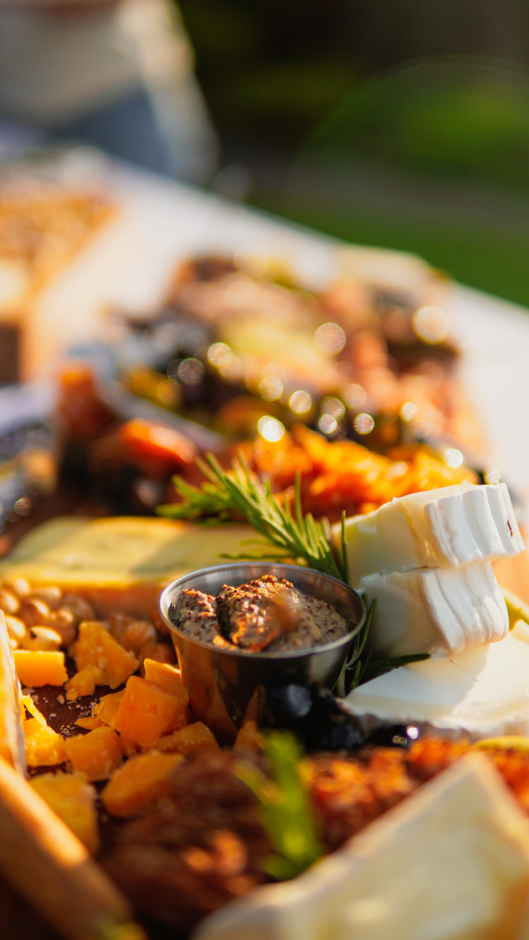 Chef-prepared charcuterie board with cheeses, cured meats, and local fruit