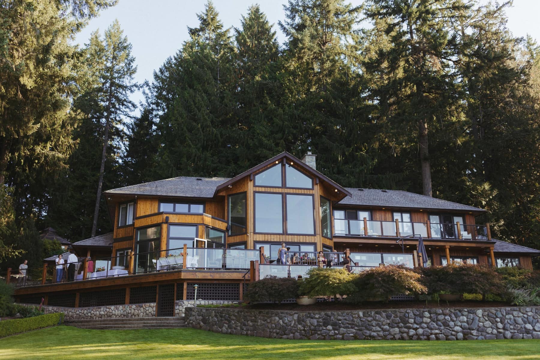 A multi-generational group gathered on the lakeside deck