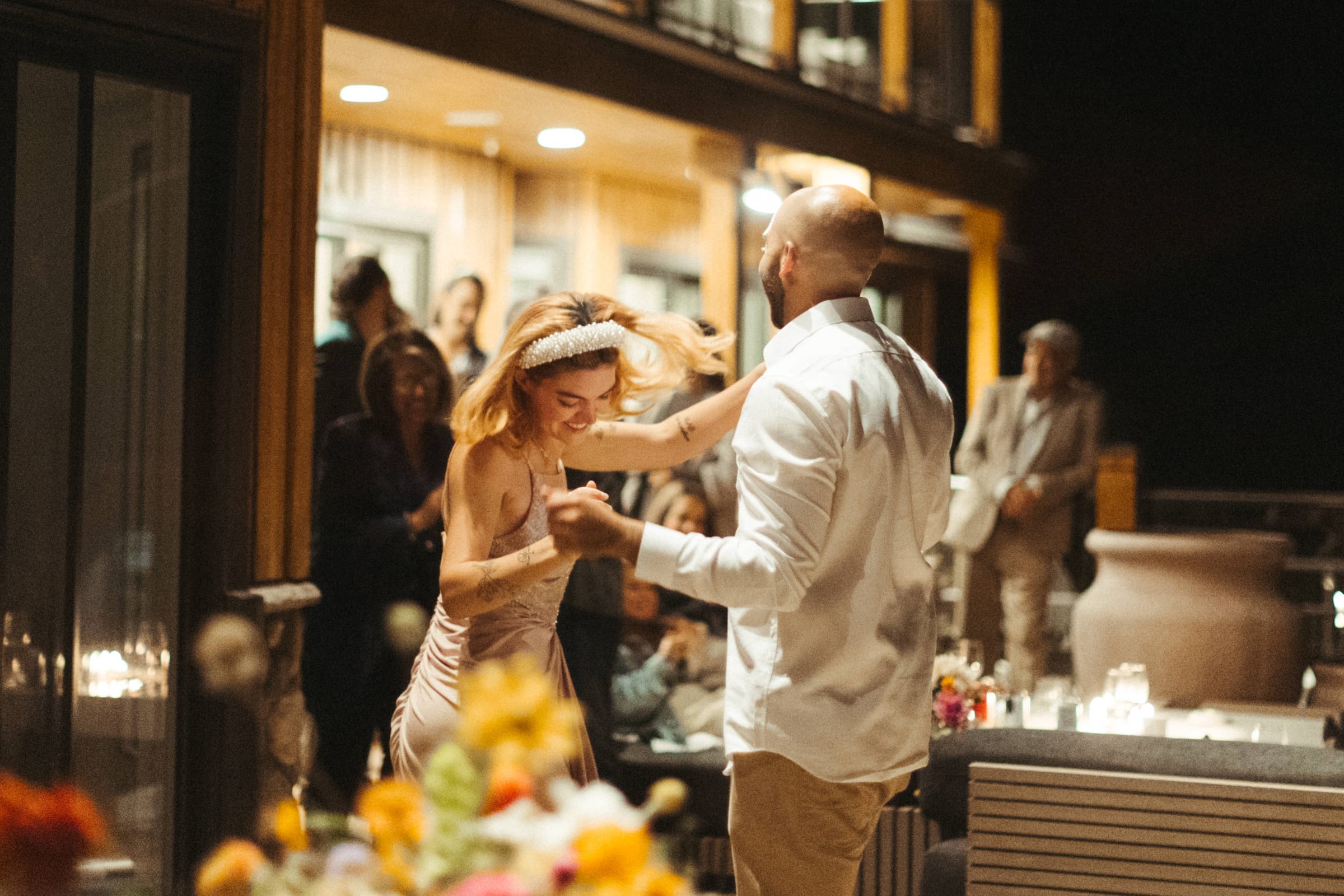Couple's first dance on the lawn at golden hour