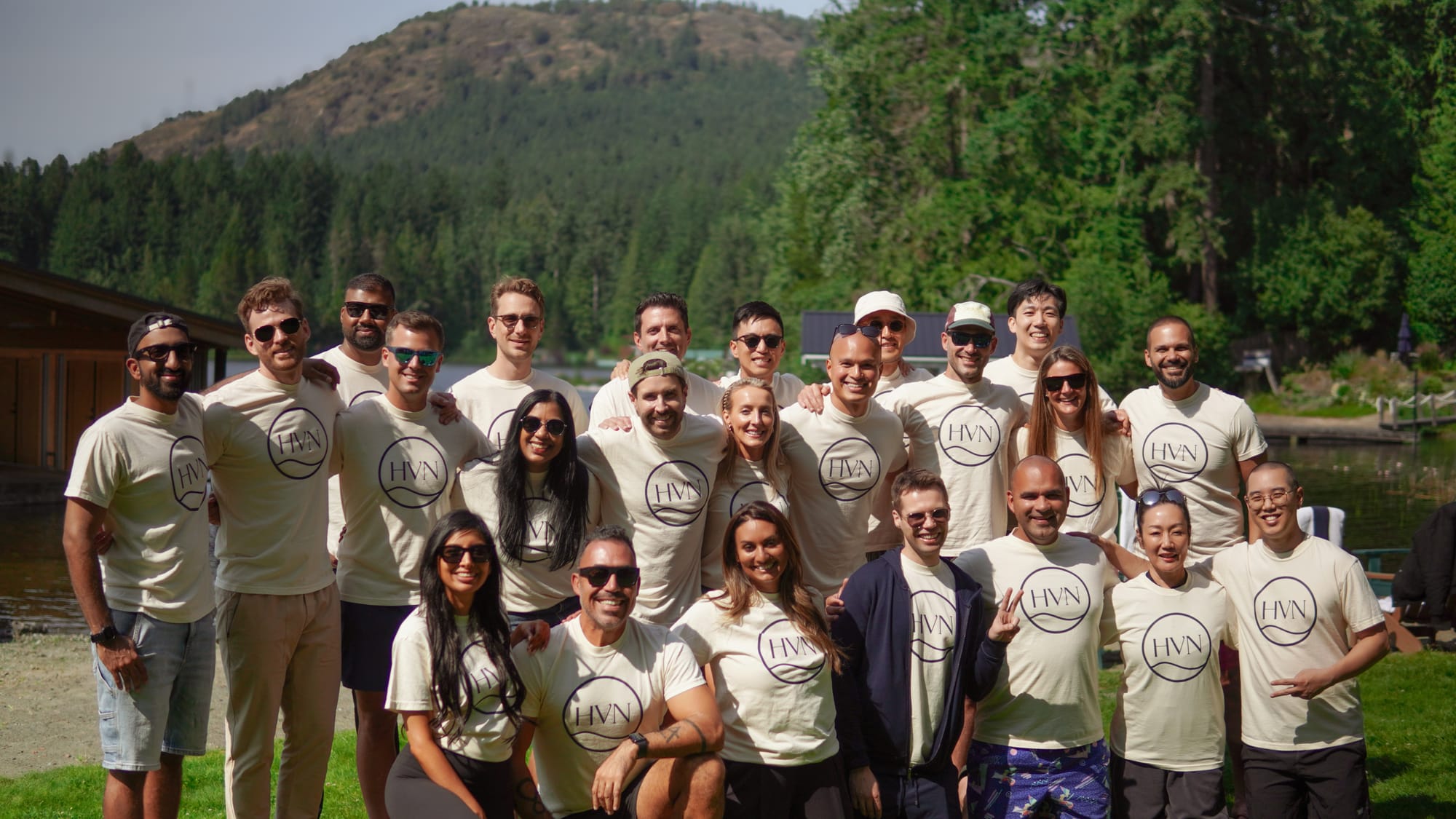 A group portrait by the lake at the close of a multi-generation gathering