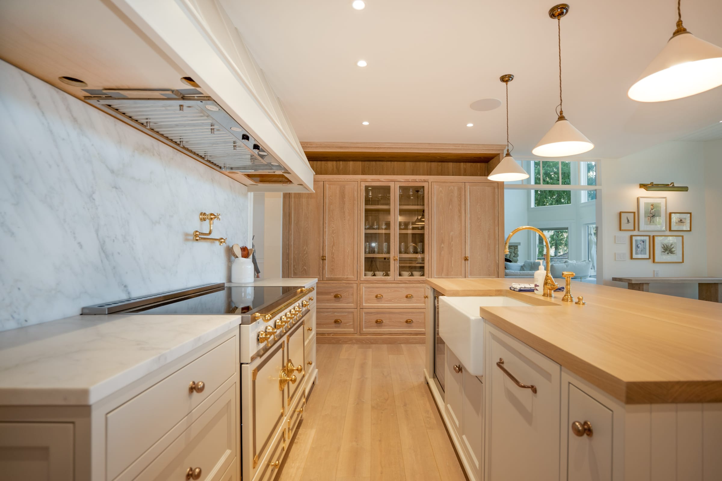 Luxury chef's kitchen with marble and brass
